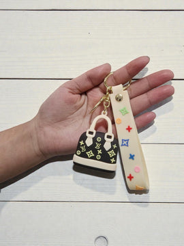 Mini Luxury-Style Handbag Keychain – Cream & Black Silicone Bag Charm
