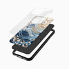 Luxury designer glass back mobile cover angled display featuring cherry blossoms and ocean wave artwork for iPhone and Android users