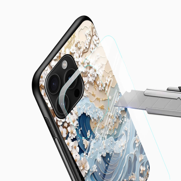 Artistic cherry blossom phone cover close-up with blue wave pattern and camera cutout detail