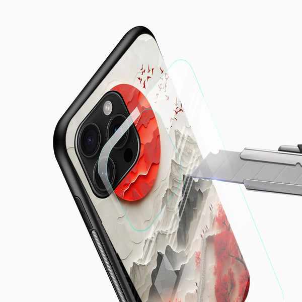 Mountain scenery mobile cover close-up with crimson trees, red sun artwork and camera cutout detail