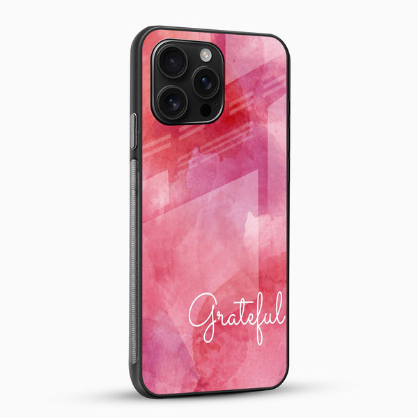 Pink watercolor aesthetic phone case with glossy glass back angled view