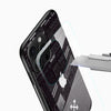 Typography graphic phone cover close-up with arrow artwork and camera cutout detail